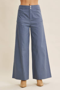 Blue wide-leg pants on a beige background