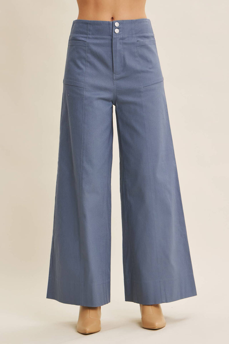 Blue wide-leg pants on a beige background